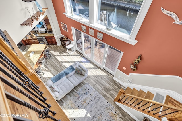 36 Joy Rd, Manahawkin, NJ 08050 - living area with light wood finished floors, a water view, and a towering ceiling