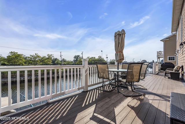 36 Joy Rd, Manahawkin, NJ 08050 - wooden deck with outdoor dining area and a water view