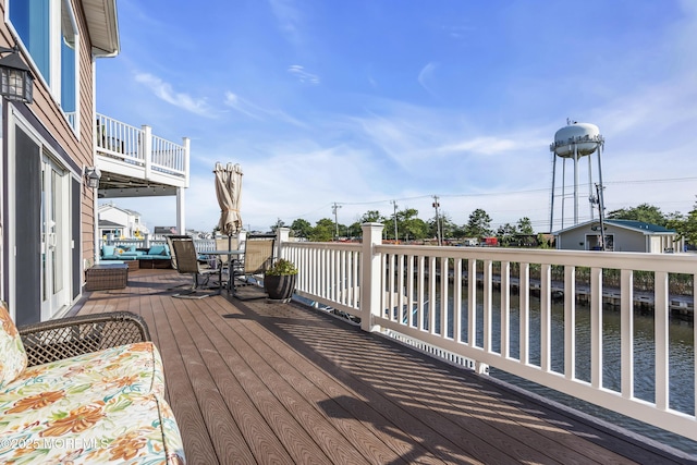36 Joy Rd, Manahawkin, NJ 08050 - wooden deck featuring a water view and outdoor dining space