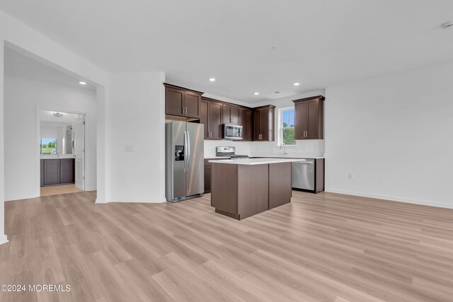 750 Lighthouse Dr Unit 1103, Barnegat, NJ 08005 - kitchen with stainless steel appliances, light wood finished floors, a center island, dark brown cabinetry, and recessed lighting