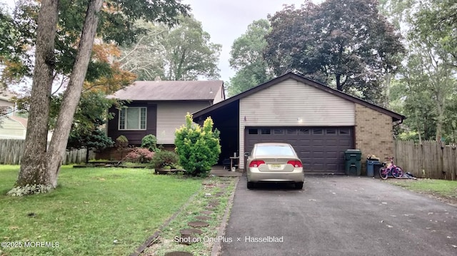 28 Chelsea Rd, Jackson, NJ 08527 - view of front facade with driveway, a garage, and brick siding