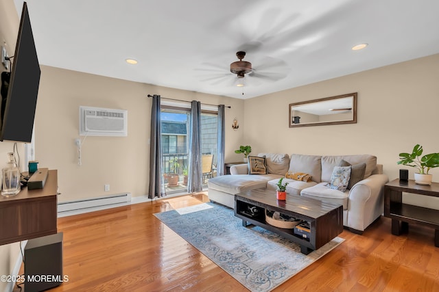720 Ocean Ave Unit 8, Long Branch, NJ 07740 - living room with a baseboard heating unit, a wall unit AC, wood finished floors, a ceiling fan, and recessed lighting