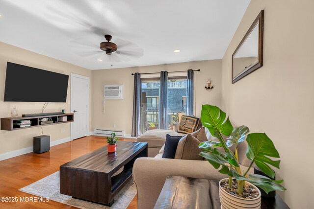 720 Ocean Ave Unit 8, Long Branch, NJ 07740 - living area featuring baseboard heating, a wall unit AC, wood finished floors, ceiling fan, and recessed lighting