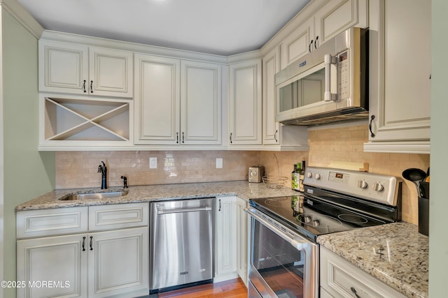 720 Ocean Ave Unit 8, Long Branch, NJ 07740 - kitchen with appliances with stainless steel finishes, tasteful backsplash, and light stone countertops