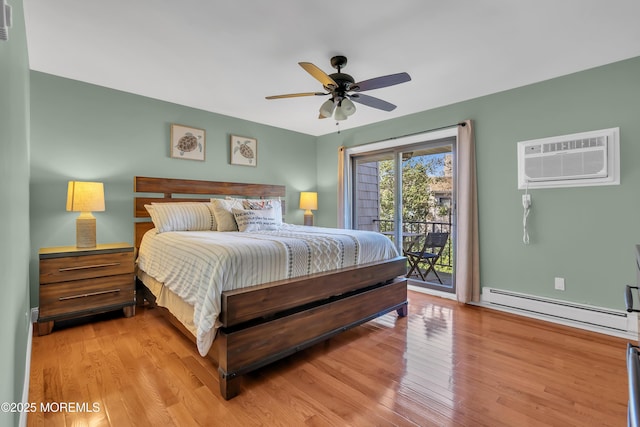 720 Ocean Ave Unit 8, Long Branch, NJ 07740 - bedroom with a baseboard heating unit, access to outside, an AC wall unit, and light wood-style flooring