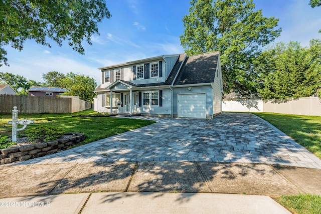 22 Tara Lin Dr, Hazlet, NJ 07730 - traditional-style home featuring covered porch, an attached garage, and decorative driveway