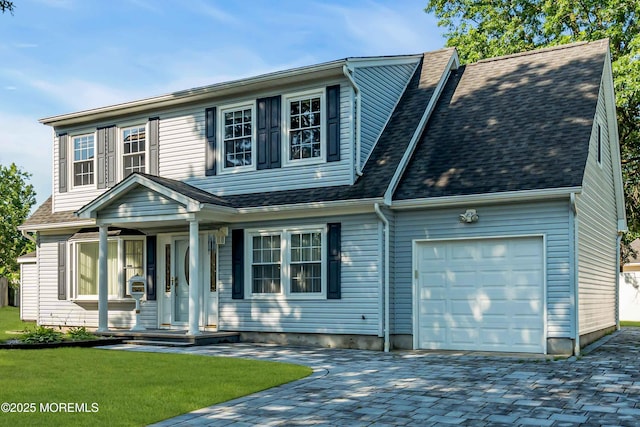 22 Tara Lin Dr, Hazlet, NJ 07730 - view of front of house with an attached garage, decorative driveway, roof with shingles, and a front yard
