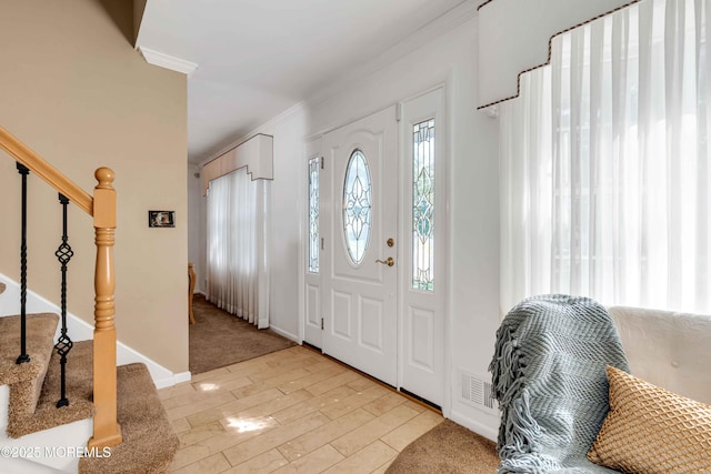 22 Tara Lin Dr, Hazlet, NJ 07730 - foyer featuring crown molding, stairway, and light wood-style flooring