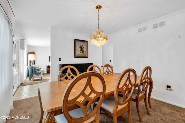 22 Tara Lin Dr, Hazlet, NJ 07730 - dining room featuring a chandelier, ornamental molding, and light colored carpet