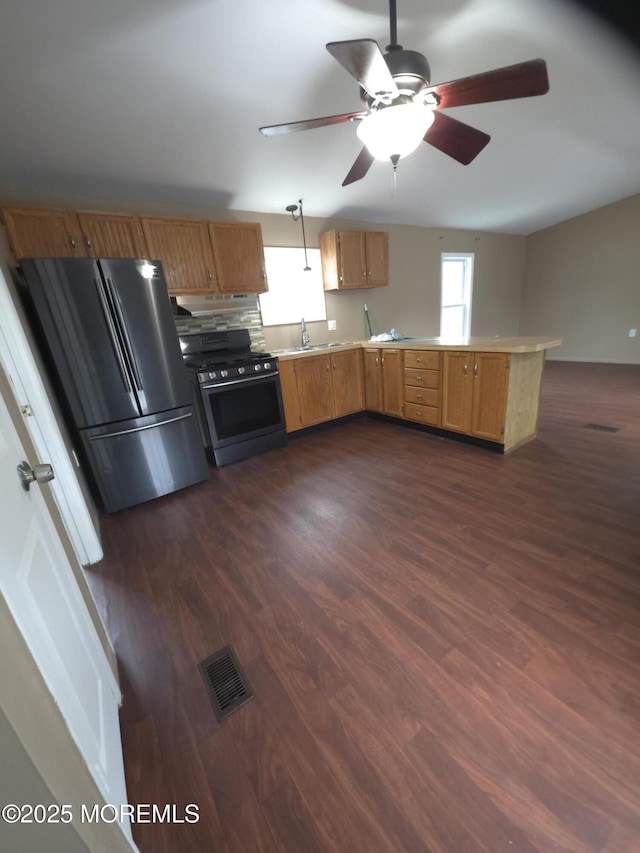 76 Secretariat St Unit 68, Howell, NJ 07731 - kitchen with black gas stove, freestanding refrigerator, a peninsula, and dark wood-type flooring