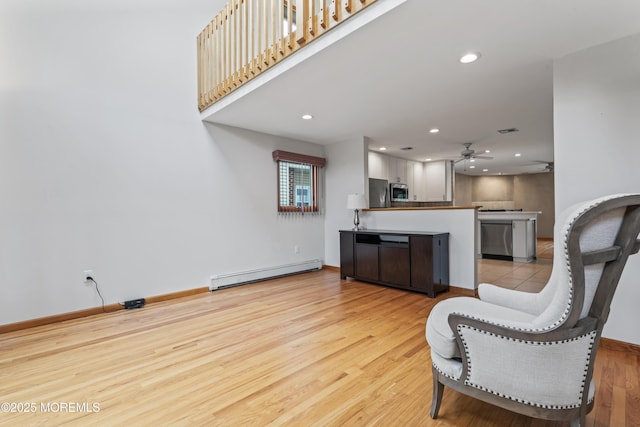 24 Bray Ave, North Middletown, NJ 07748 - living room with baseboard heating, ceiling fan, light wood-style floors, and recessed lighting