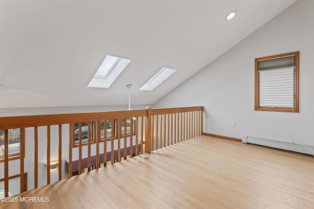 24 Bray Ave, North Middletown, NJ 07748 - bonus room featuring a skylight, lofted ceiling, baseboard heating, recessed lighting, and wood finished floors