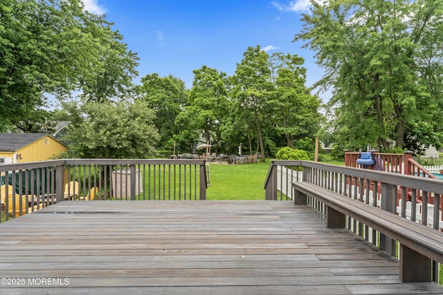 24 Bray Ave, North Middletown, NJ 07748 - deck featuring a lawn and view of wooded area