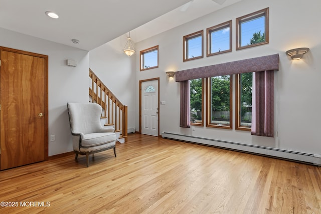 24 Bray Ave, North Middletown, NJ 07748 - entryway featuring a baseboard heating unit, healthy amount of natural light, and light wood finished floors