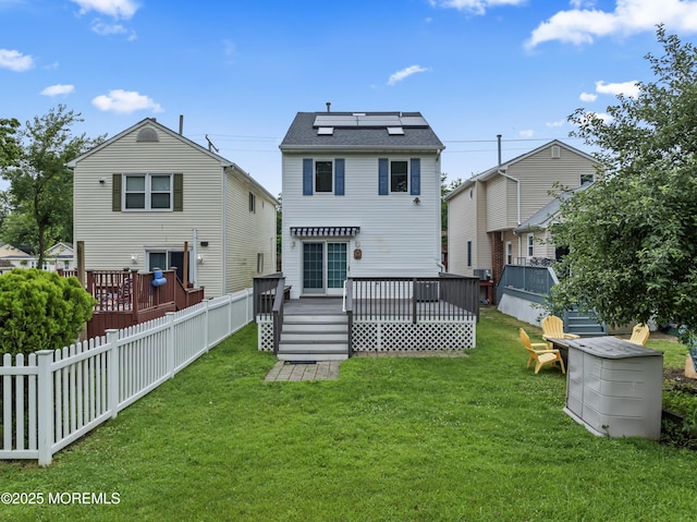 24 Bray Ave, North Middletown, NJ 07748 - rear view of house with a deck and solar panels