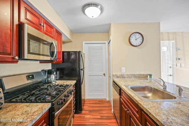 147 Longfield Ct # 147, East Brunswick, NJ 08816 - kitchen featuring stainless steel appliances, dark brown cabinets, and dark wood-style flooring