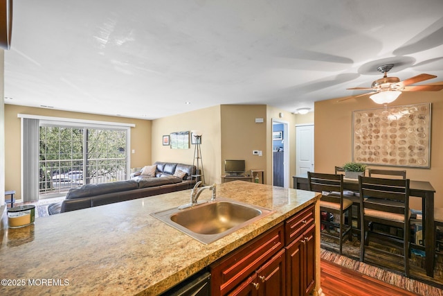 147 Longfield Ct # 147, East Brunswick, NJ 08816 - kitchen with dark brown cabinets, open floor plan, a ceiling fan, and dark wood-style flooring