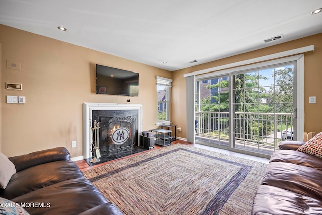 147 Longfield Ct # 147, East Brunswick, NJ 08816 - living area featuring a warm lit fireplace, wood finished floors, and recessed lighting