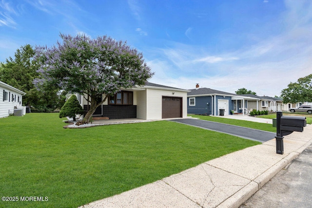 324 Barbados Dr N, Toms River, NJ 08757 - view of front of property featuring an attached garage, asphalt driveway, and a front yard