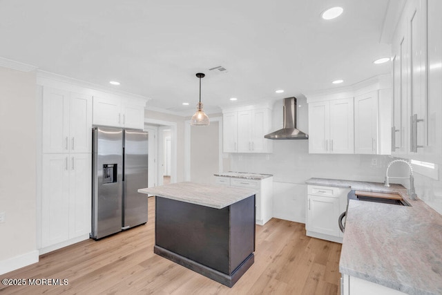 324 Barbados Dr N, Toms River, NJ 08757 - kitchen featuring stainless steel fridge with ice dispenser, wall chimney exhaust hood, light wood finished floors, white cabinets, and recessed lighting