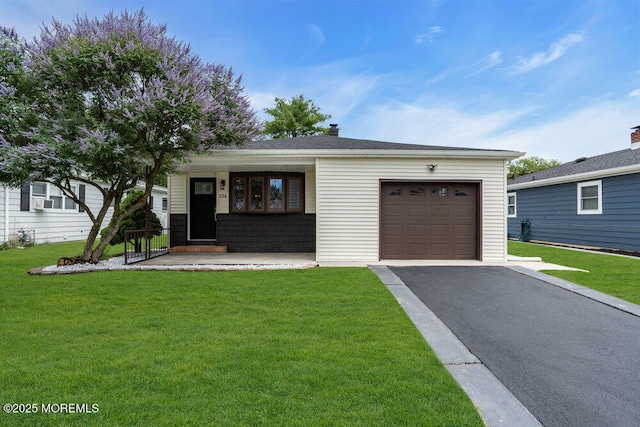 324 Barbados Dr N, Toms River, NJ 08757 - view of front of home with asphalt driveway, a garage, a front yard, and a porch