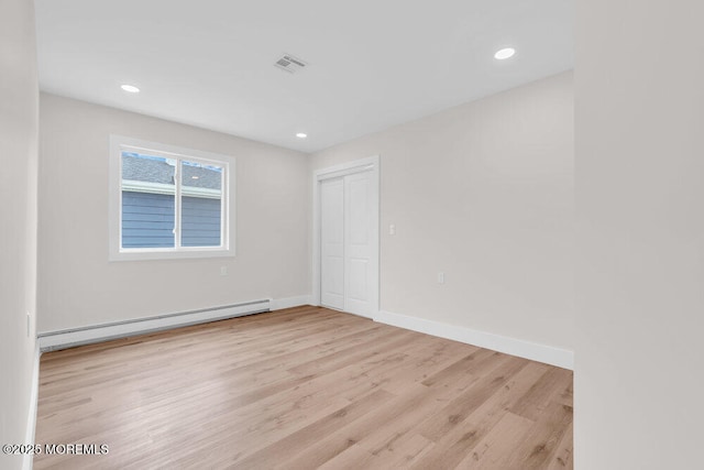 324 Barbados Dr N, Toms River, NJ 08757 - unfurnished room featuring a baseboard heating unit, light wood-style floors, and recessed lighting