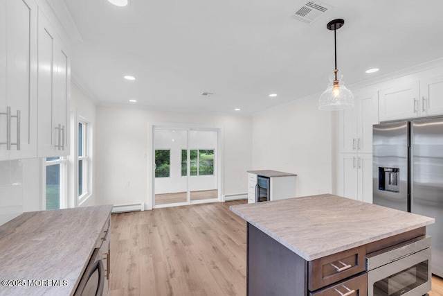 324 Barbados Dr N, Toms River, NJ 08757 - kitchen featuring stainless steel appliances, white cabinetry, a baseboard heating unit, light stone counters, and light wood-style floors
