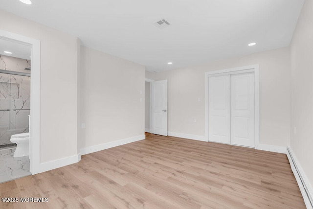 324 Barbados Dr N, Toms River, NJ 08757 - unfurnished bedroom featuring baseboard heating, light wood-style floors, a closet, recessed lighting, and ensuite bath