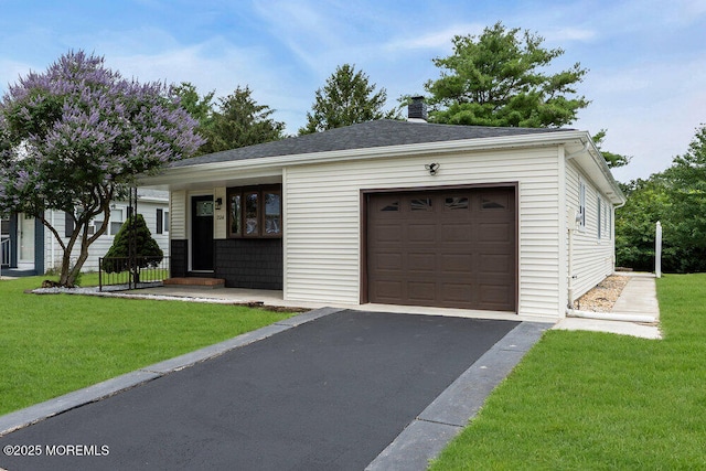 324 Barbados Dr N, Toms River, NJ 08757 - view of front of house featuring a front yard, a garage, asphalt driveway, and a chimney
