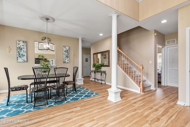 2 Moet Ct, Manchester, NJ 08759 - dining space featuring ornate columns, wood finished floors, stairs, and recessed lighting