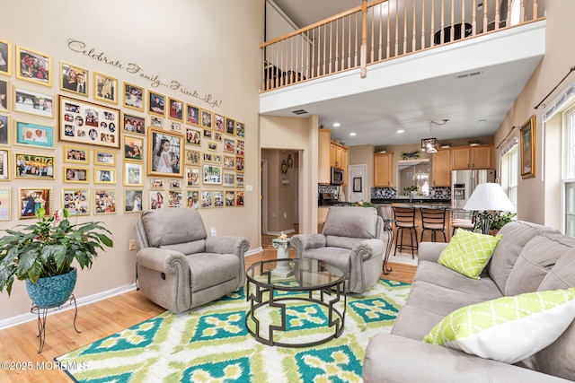 2 Moet Ct, Manchester, NJ 08759 - living area with light wood-style floors and a towering ceiling