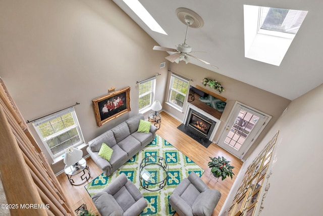 2 Moet Ct, Manchester, NJ 08759 - living area with a skylight, high vaulted ceiling, a fireplace with flush hearth, wood finished floors, and ceiling fan