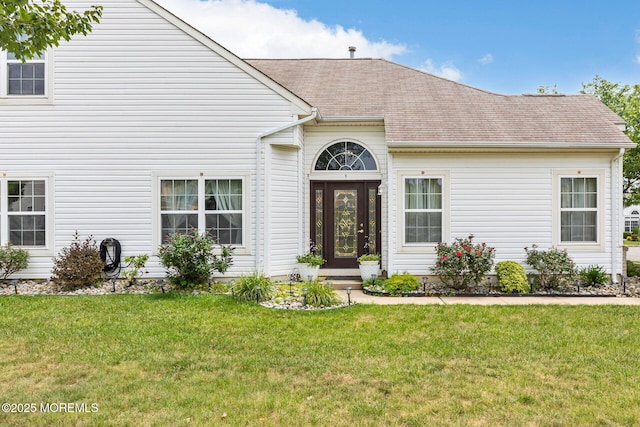 2 Moet Ct, Manchester, NJ 08759 - view of exterior entry featuring a lawn and a shingled roof