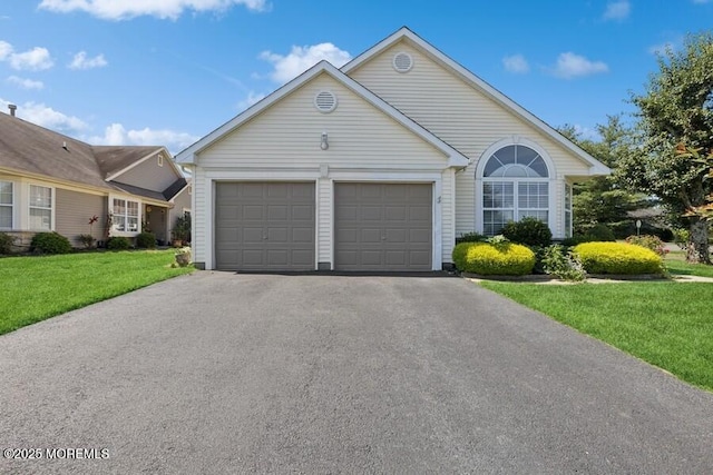 2525 Spring Hill Dr, Toms River, NJ 08755 - ranch-style home with asphalt driveway, an attached garage, and a front yard