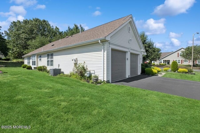 2525 Spring Hill Dr, Toms River, NJ 08755 - view of side of property with a yard, roof with shingles, and a detached garage