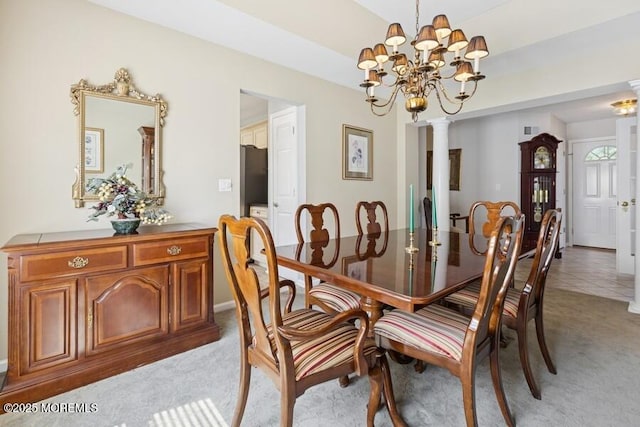 2525 Spring Hill Dr, Toms River, NJ 08755 - dining area featuring light colored carpet, a chandelier, and ornate columns