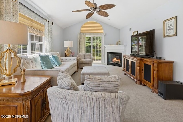 2525 Spring Hill Dr, Toms River, NJ 08755 - living room with carpet, vaulted ceiling, a ceiling fan, and a glass covered fireplace