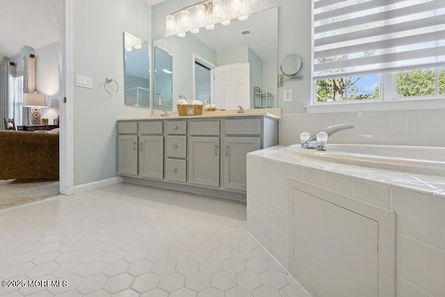 2525 Spring Hill Dr, Toms River, NJ 08755 - ensuite bathroom with double vanity, a garden tub, and tile patterned flooring