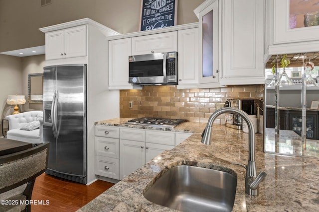 98 Yorkwood Dr, Brick, NJ 08723 - kitchen with appliances with stainless steel finishes, white cabinets, backsplash, and light stone countertops