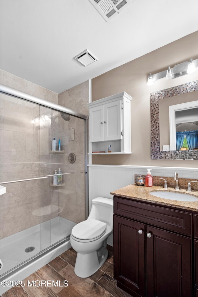 98 Yorkwood Dr, Brick, NJ 08723 - full bath featuring vanity, a stall shower, a wainscoted wall, and wood finish floors