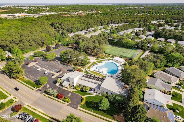 98 Yorkwood Dr, Brick, NJ 08723 - drone / aerial view of a pool and a heavily wooded area
