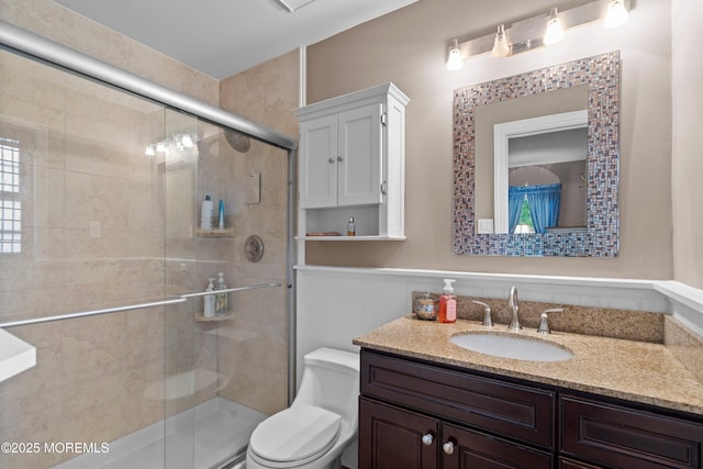 98 Yorkwood Dr, Brick, NJ 08723 - full bathroom featuring vanity, a wainscoted wall, and a shower stall