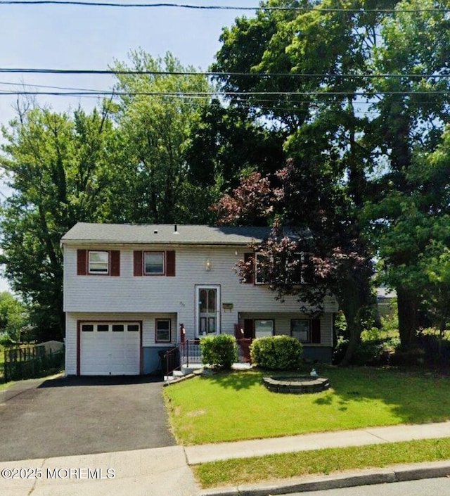 975 S Concourse, Keyport, NJ 07735 - bi-level home with a garage, asphalt driveway, and a front lawn