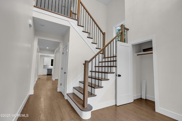 21 Pension Hill Rd, Manalapan, NJ 07726 - stairs featuring wood finished floors and a high ceiling