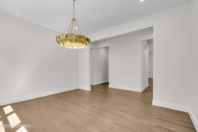 21 Pension Hill Rd, Manalapan, NJ 07726 - spare room featuring a chandelier, wood finished floors, and recessed lighting