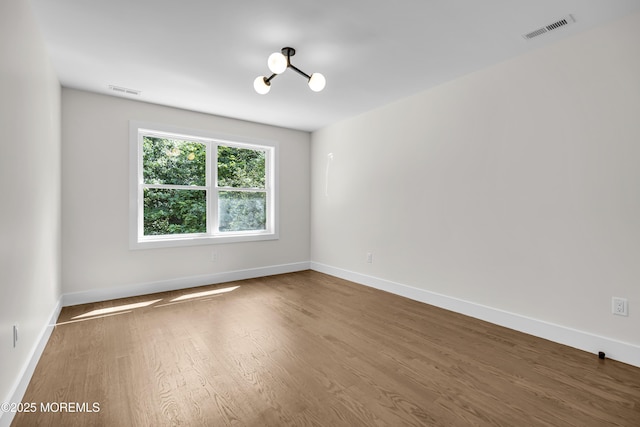 21 Pension Hill Rd, Manalapan, NJ 07726 - unfurnished room with wood finished floors and baseboards