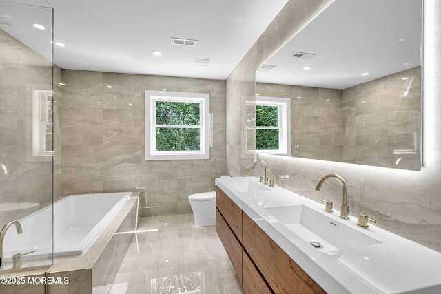 21 Pension Hill Rd, Manalapan, NJ 07726 - full bath featuring tile walls, tiled tub, double vanity, and marble finish floors