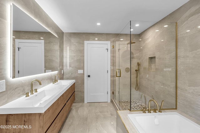 21 Pension Hill Rd, Manalapan, NJ 07726 - full bath with a garden tub, double vanity, a shower stall, marble finish floors, and tile walls
