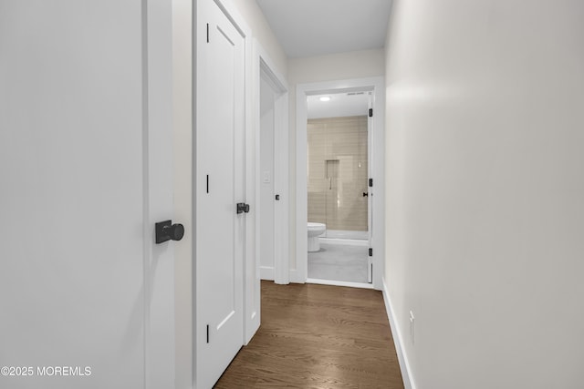 21 Pension Hill Rd, Manalapan, NJ 07726 - corridor with dark wood-style floors and baseboards
