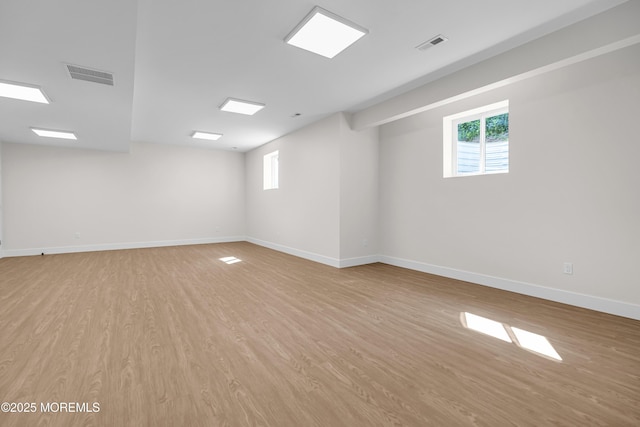 21 Pension Hill Rd, Manalapan, NJ 07726 - spare room featuring wood finished floors and plenty of natural light